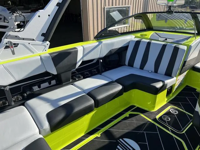 Slide: The Image of 2024 Malibu 22 LSV boat interior with black and white seating. - 6