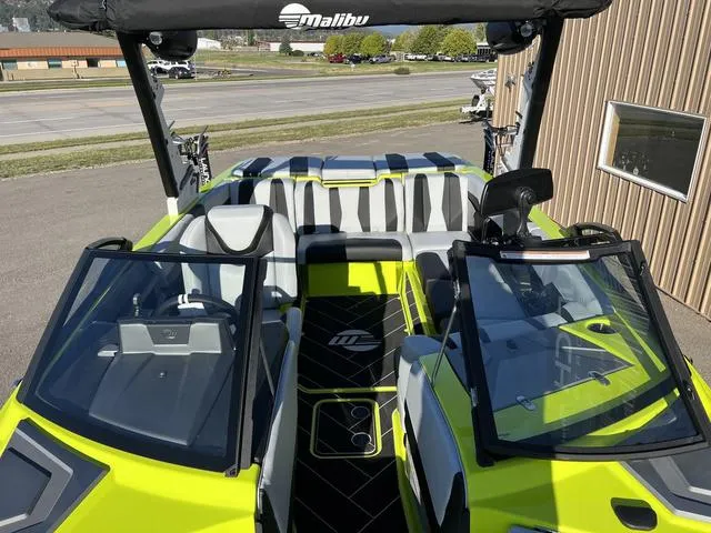 Slide: The Image of 2024 Malibu 22 LSV boat interior with lime green and black accents. - 8