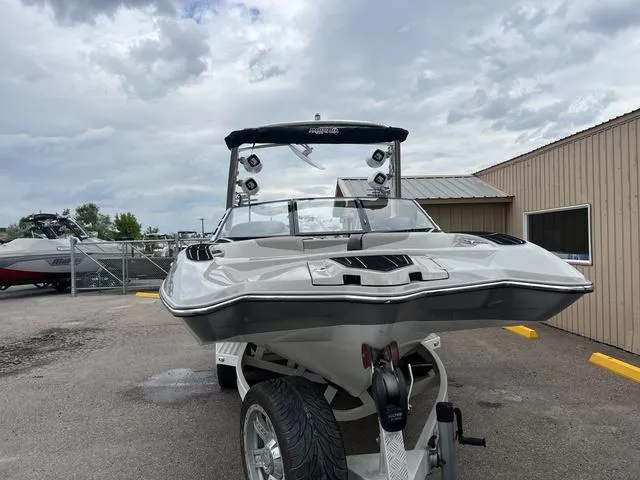 Slide: The Image of 2013 Malibu Wakesetter 22 MXZ boat on trailer in outdoor lot. - 3
