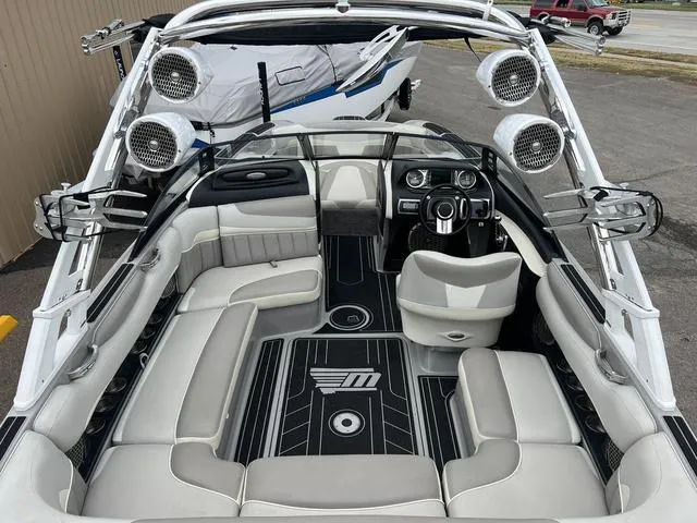 Slide: The Image of 2013 Malibu Wakesetter 22 MXZ interior with premium seating and advanced audio system. - 4