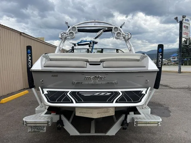 Slide: The Image of 2013 Malibu Wakesetter 22 MXZ boat rear view with wakeboard tower and swim platform. - 5
