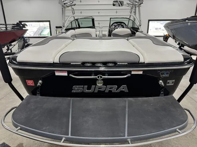 Slide: The Image of 2007 Supra 21V LTD boat in a warehouse, rear view. - 11