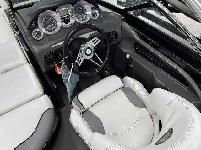 Slide: The Image of 2007 Supra Boats 21V LTD interior with steering wheel and dashboard controls. - 14