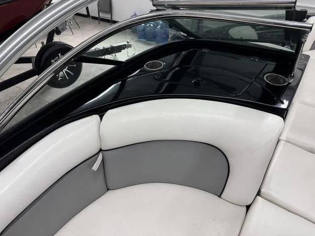 Slide: The Image of 2007 Supra Boats 21V LTD interior with white and gray seating, cup holders, and sleek design. - 15