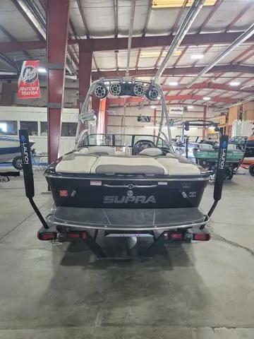 Slide: The Image of 2007 Supra 21V LTD boat interior with white and gray seating. - 2