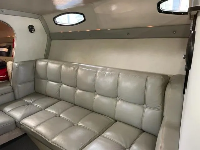 Slide: The Image of Interior of 1989 Baja 370 Force boat with gray leather seating. - 11