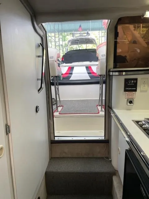 Slide: The Image of Interior view of 1989 Baja 370 Force boat with kitchen and seating area. - 13