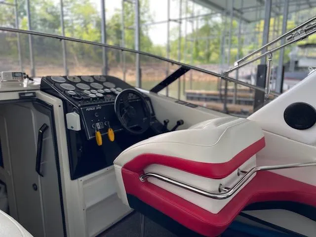Slide: The Image of Interior of a 1989 Baja 370 Force boat with steering wheel and control panel. - 4