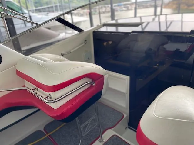 Slide: The Image of Interior of a 1989 Baja 370 Force boat with white and red seating. - 5