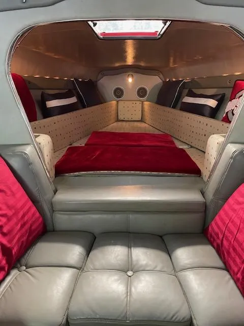 Slide: The Image of Interior cabin of a 1989 Baja 370 Force boat with red and gray upholstery. - 9