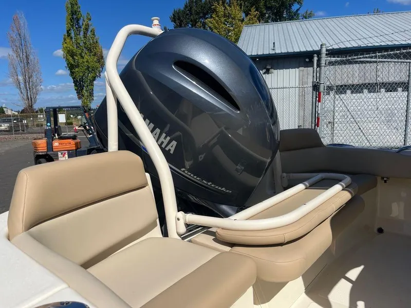 Slide: The Image of 2024 Scout 195 SF boat with Yamaha outboard motor and beige seating. - 12