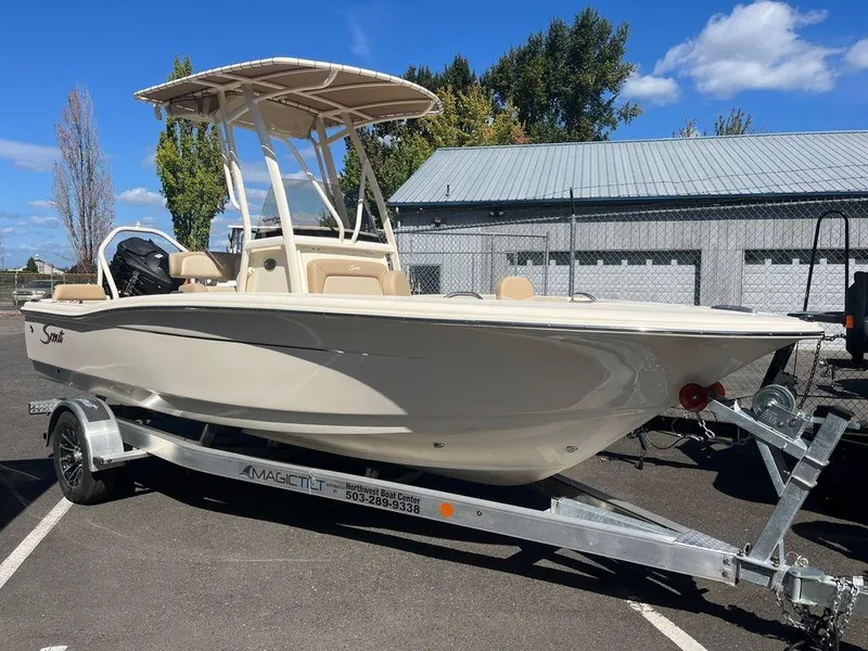 Slide: The Image of 2024 Scout 195 SF boat on trailer in parking lot. - 4