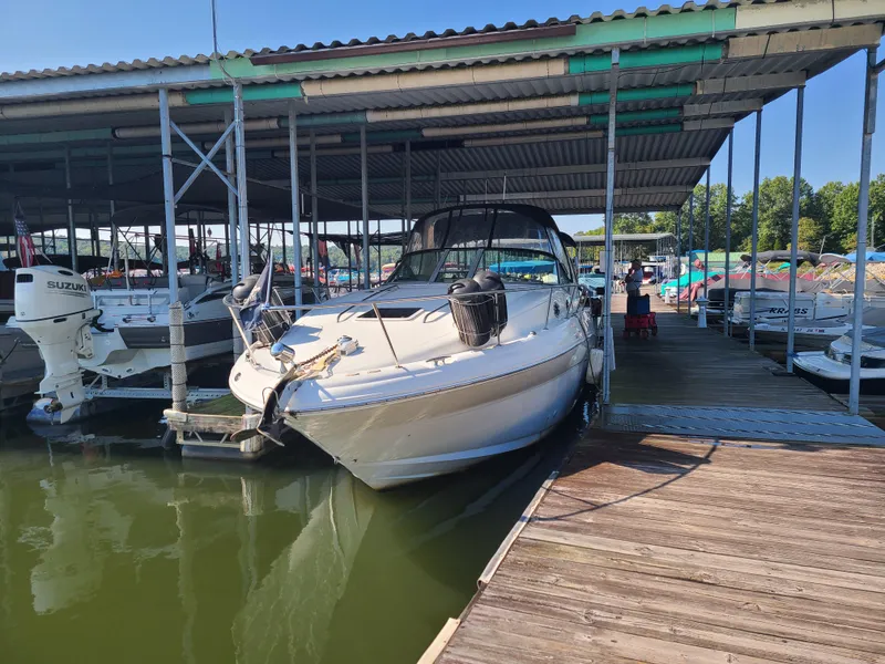 Slide: The Image of 2002 Sea Ray 320 Sundancer docked at a marina. - 21