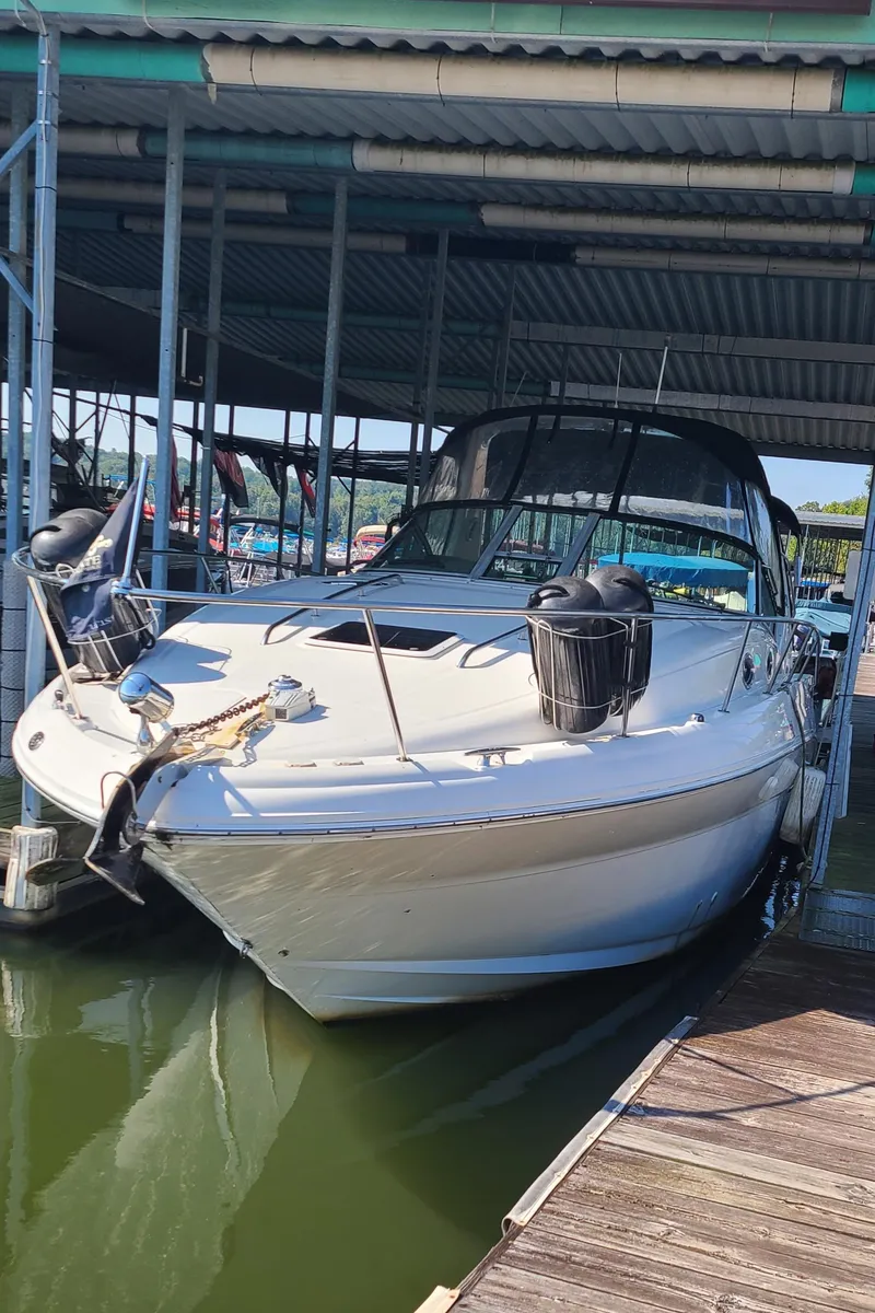 Slide: The Image of 2002 Sea Ray 320 Sundancer docked in a marina. - 25