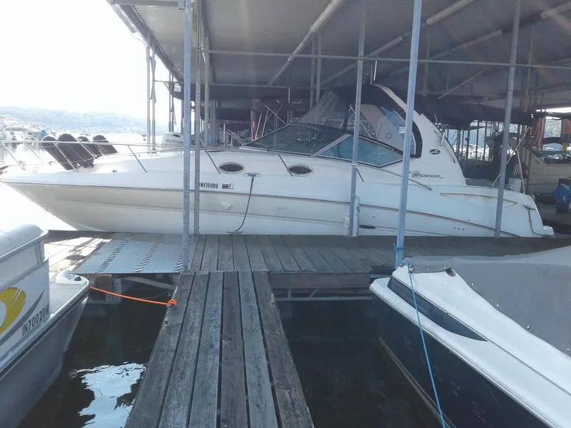 Slide: The Image of 2002 Sea Ray 320 Sundancer docked in a marina. - 26