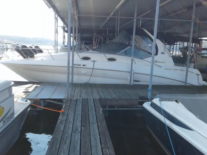 Slide: The Image of 2002 Sea Ray 320 Sundancer docked in a marina. - 28