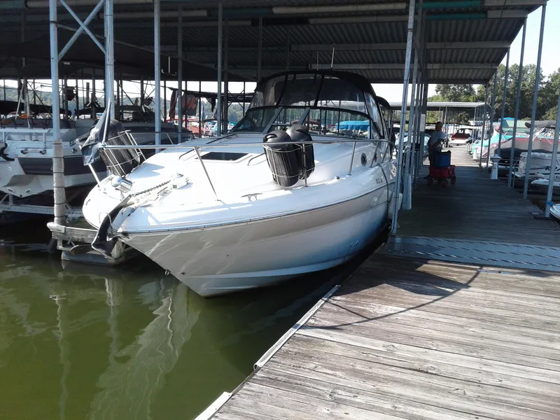 Slide: The Image of 2002 Sea Ray 320 Sundancer docked at a marina. - 29