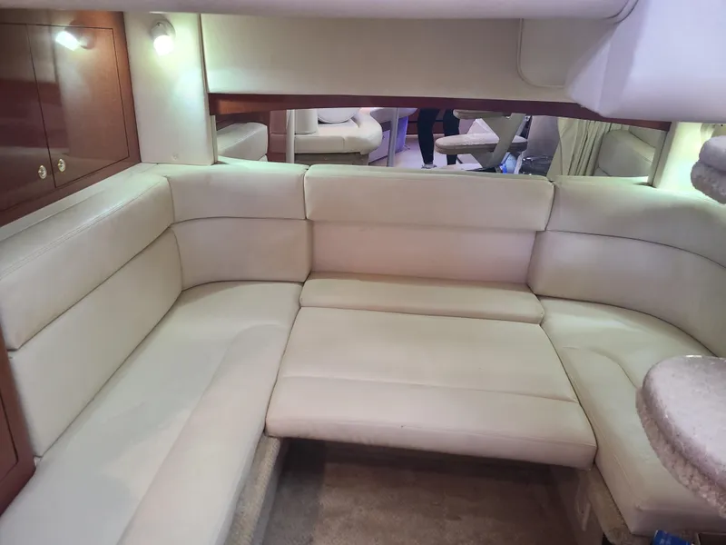 Slide: The Image of Interior seating area of a 2002 Sea Ray 320 Sundancer yacht. - 45