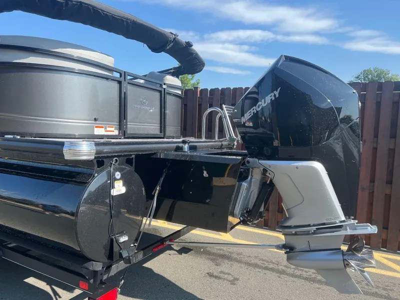 Slide: The Image of 2023 Regency 250 LE3 pontoon boat with Mercury outboard motor. - 1
