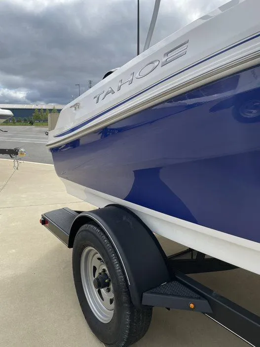 Slide: The Image of 2024 Tahoe 185 S boat on trailer, side view. - 2