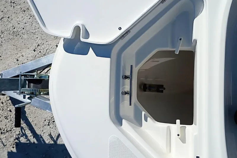 Slide: The Image of Open storage compartment on 2026 Pioneer 180 Sportfish boat, showing interior details. - 14