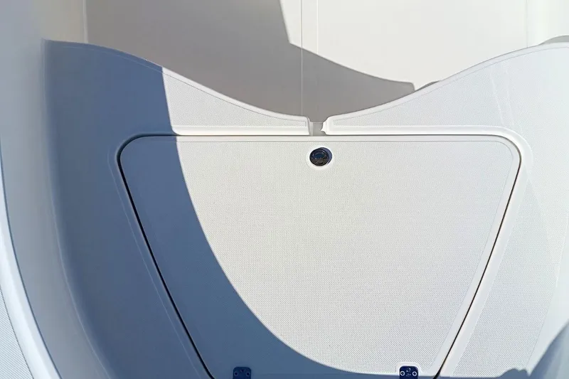Slide: The Image of 2026 Pioneer 180 Sportfish boat interior detail with storage compartment. - 16