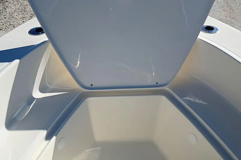 Slide: The Image of Open storage compartment on 2026 Pioneer 180 Sportfish boat, showcasing interior space. - 17