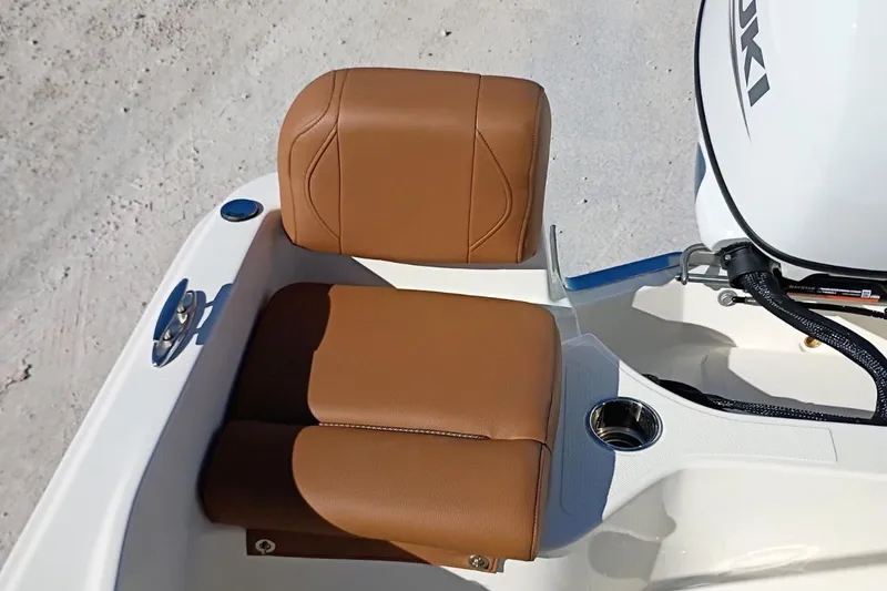Slide: The Image of Brown leather seating on 2026 Pioneer 180 Sportfish boat, featuring a Suzuki engine. - 25
