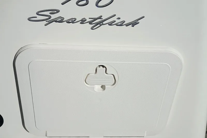 Slide: The Image of 2026 Pioneer 180 Sportfish boat detail with hatch and model name. - 29