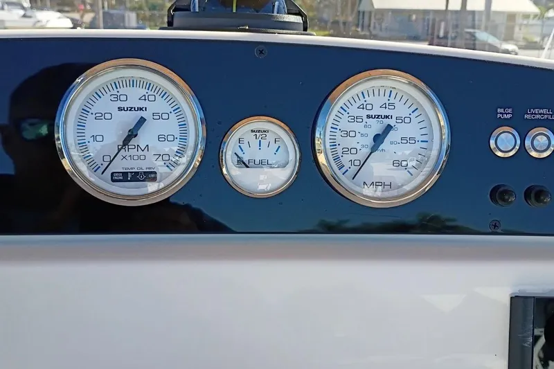Slide: The Image of Dashboard of a 2026 Pioneer 180 Sportfish boat with Suzuki gauges and controls. - 6