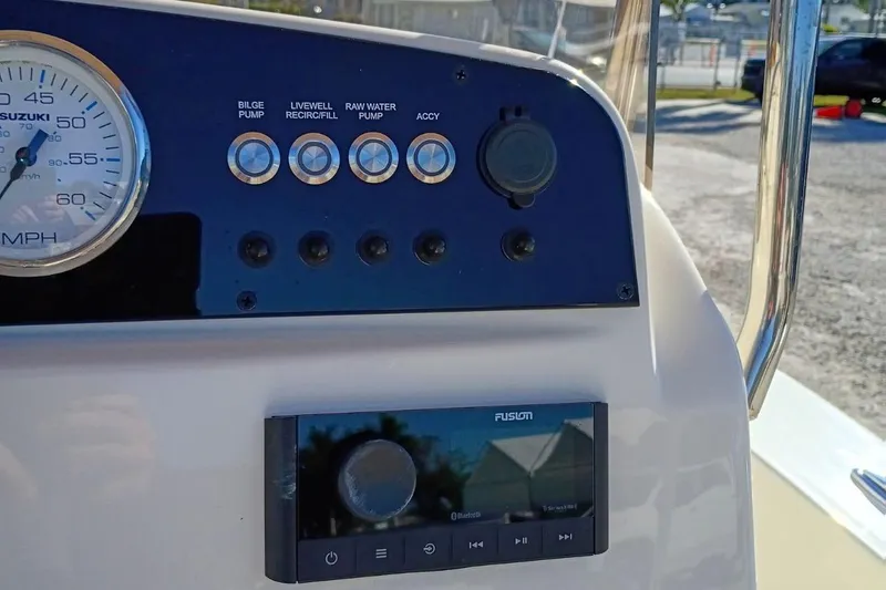 Slide: The Image of Control panel of 2026 Pioneer 180 Sportfish boat with gauges and switches. - 7