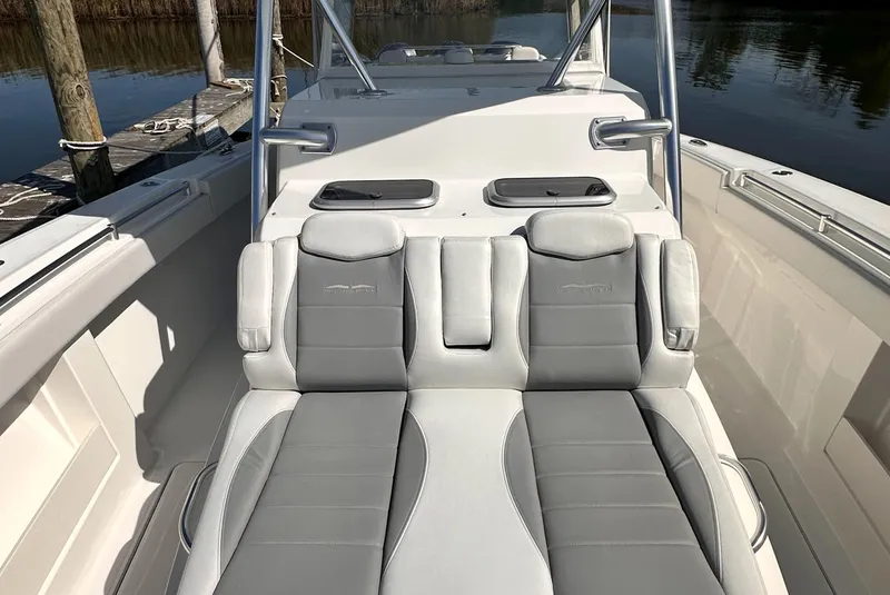 Slide: The Image of 2017 Invincible 42 Center Cabin boat with cushioned seating. - 10
