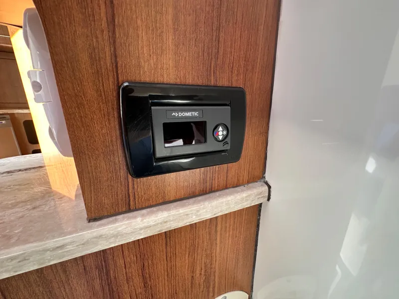 Slide: The Image of Dometic control panel in 2017 Invincible 42 Center Cabin boat interior. - 27