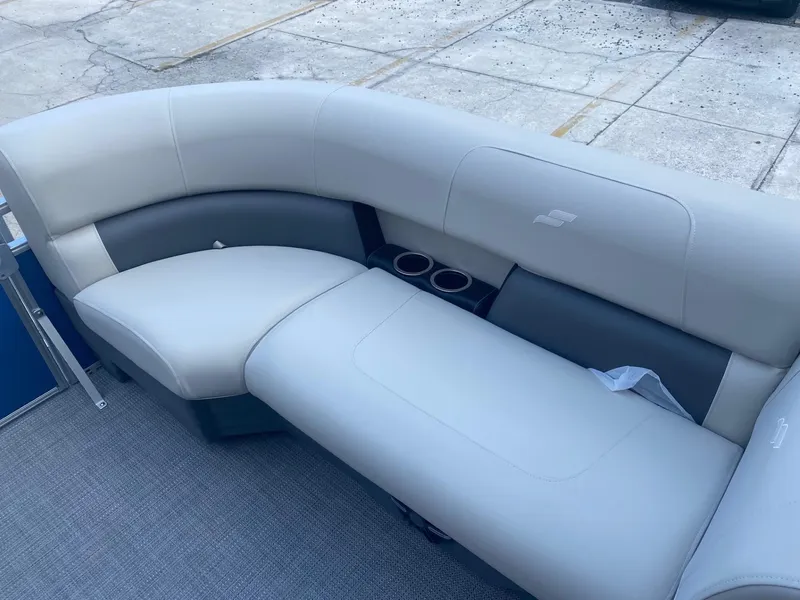 Slide: The Image of 2024 Starcraft LX 20 R pontoon boat with comfortable seating and cup holders. - 17