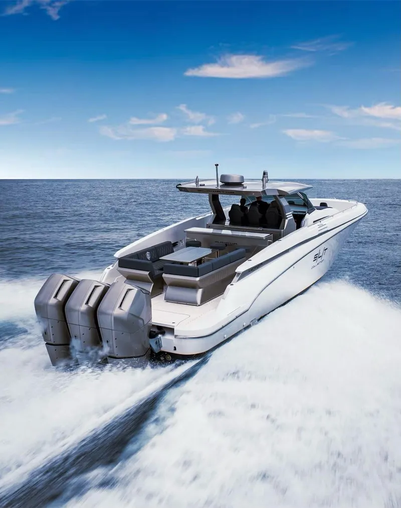 Slide: The Image of 2023 Canados 493 Gladiator speedboat cruising on open water, showcasing powerful engines. - 1