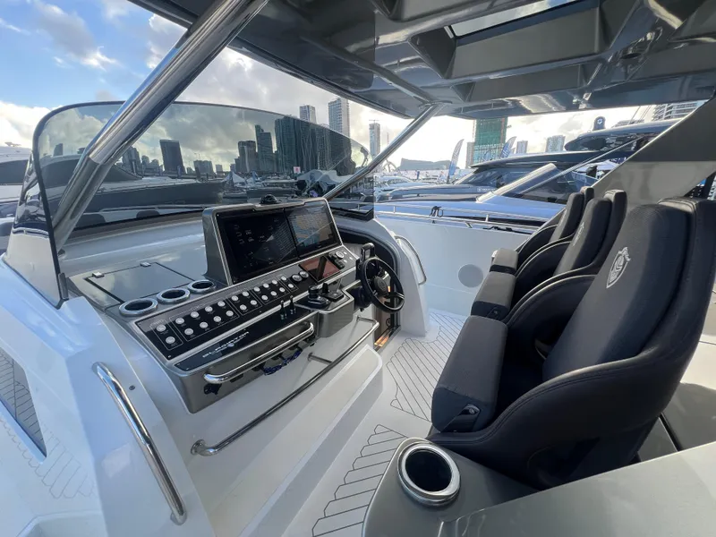 Slide: The Image of 2023 Canados 493 Gladiator yacht cockpit with modern controls and luxurious seating. - 11