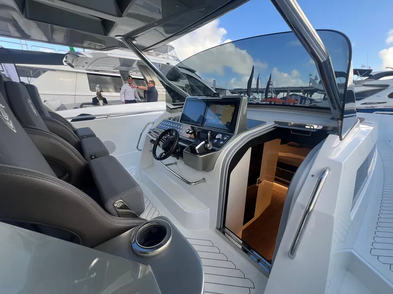 Slide: The Image of 2023 Canados 493 Gladiator yacht cockpit with modern controls and luxurious seating. - 12