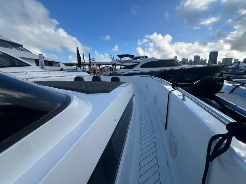 Slide: The Image of 2023 Canados 493 Gladiator yacht docked at marina under blue sky. - 14