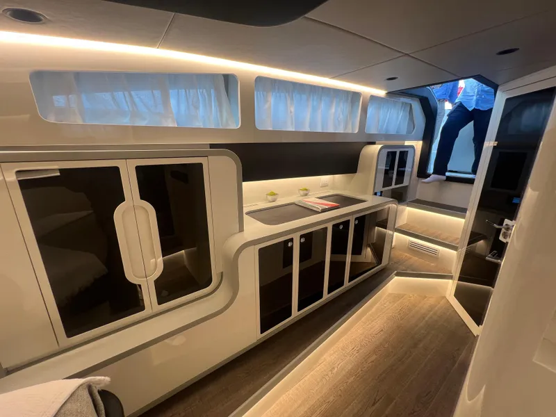 Slide: The Image of Luxurious interior of 2023 Canados 493 Gladiator yacht, featuring modern kitchen and sleek design. - 21