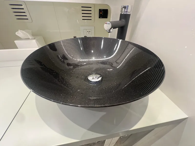 Slide: The Image of Carbon fiber sink in 2023 Canados 493 Gladiator yacht bathroom. - 23