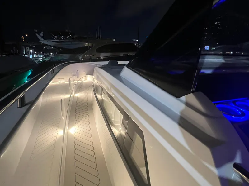 Slide: The Image of 2023 Canados 493 Gladiator yacht deck illuminated at night, showcasing sleek design and modern features. - 26