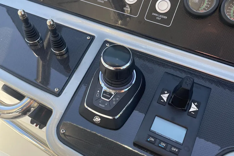 Slide: The Image of Control panel of 2023 Canados 493 Gladiator yacht with joystick and switches. - 3