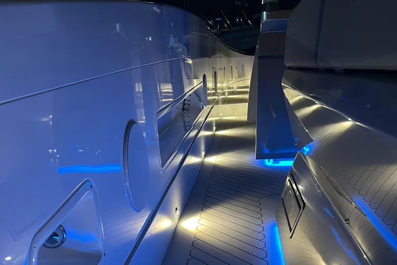 Slide: The Image of 2023 Canados 493 Gladiator yacht interior with ambient blue lighting. - 31