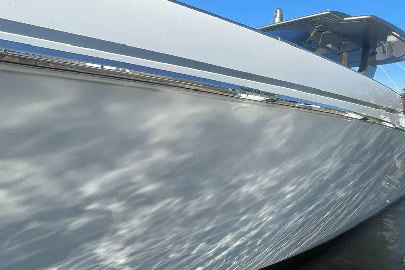 Slide: The Image of 2023 Canados 493 Gladiator yacht side view with water reflections. - 38