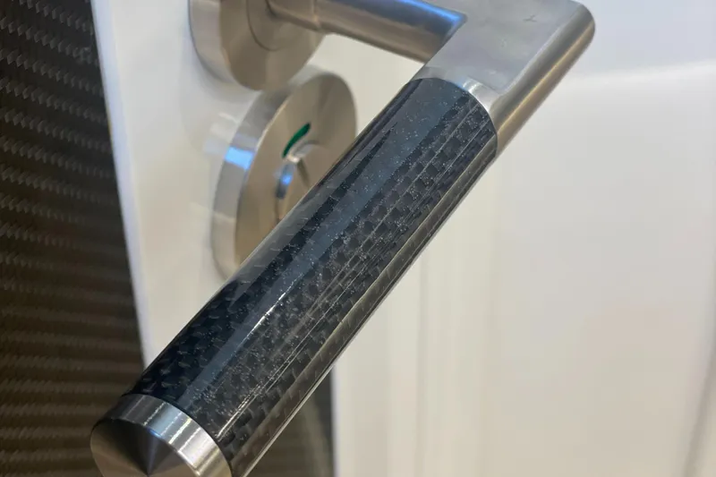 Slide: The Image of 2023 Canados 493 Gladiator door handle with sleek carbon fiber design. - 40