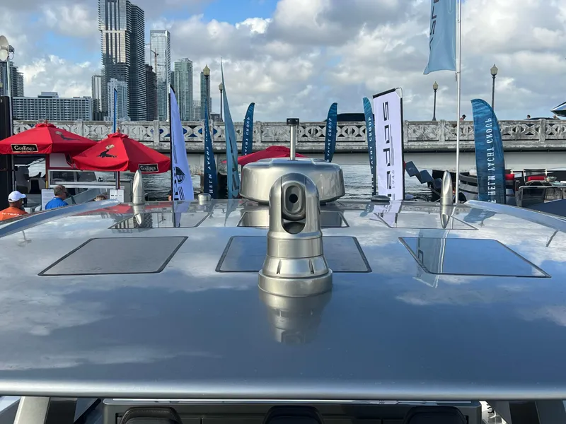 Slide: The Image of 2023 Canados 493 Gladiator yacht with city skyline and flags in the background. - 45