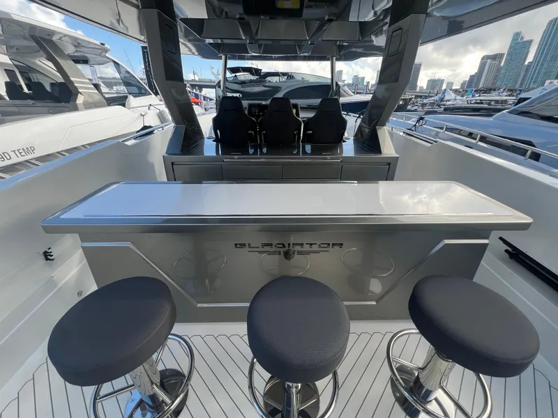 Slide: The Image of 2023 Canados 493 Gladiator yacht interior with sleek bar and modern seating. - 7