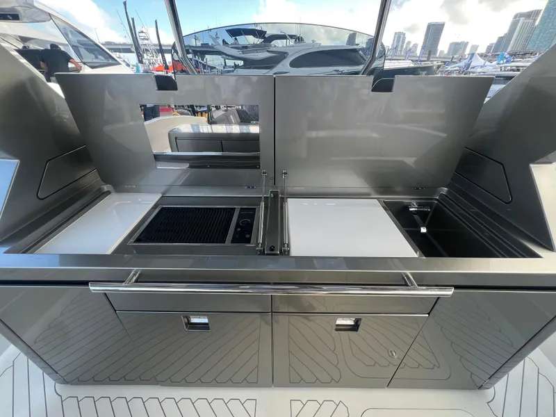 Slide: The Image of 2023 Canados 493 Gladiator yacht kitchen with sleek stainless steel design. - 9