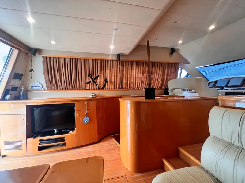 Slide: The Image of Interior of 2001 Uniesse Flybridge 48 yacht with wooden cabinetry and modern amenities. - 15