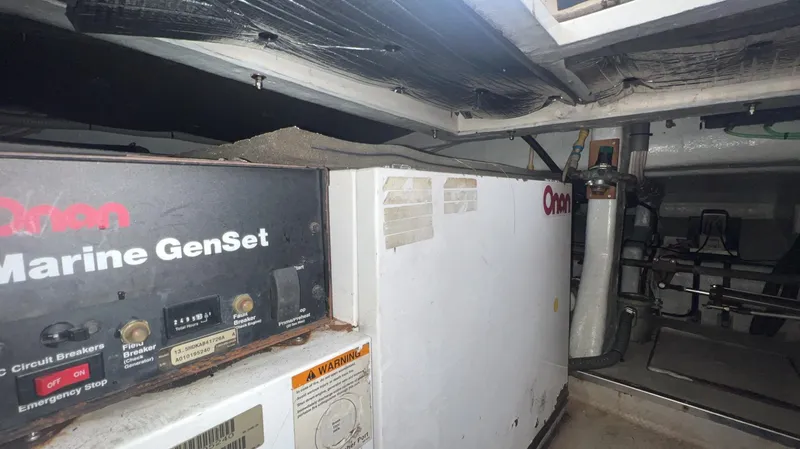 Slide: The Image of Engine room of a 2001 Uniesse Flybridge 48 with Onan Marine GenSet. - 35